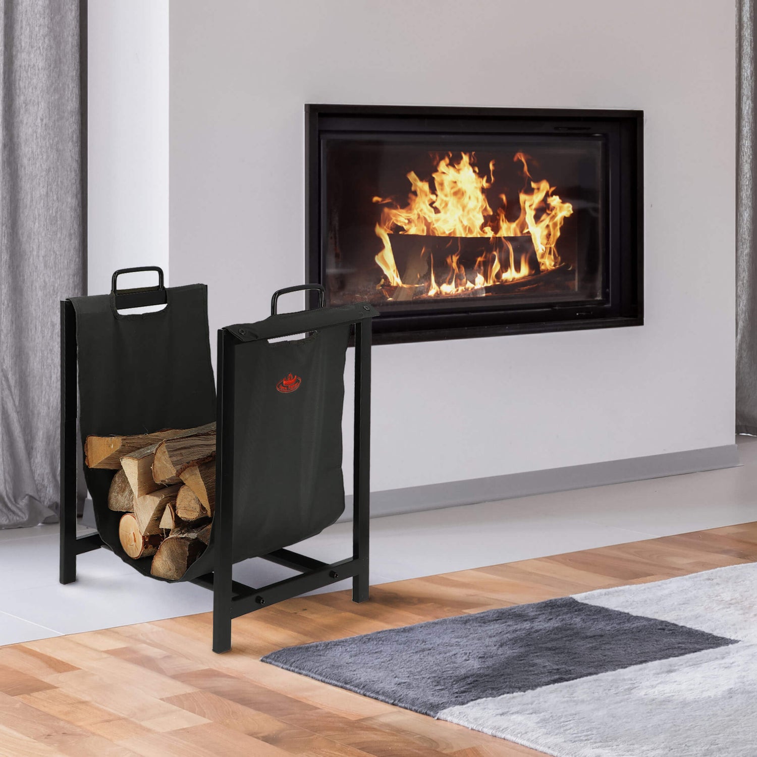 Modern fireplace with burning fire and a black metal firewood holder on a wooden floor.