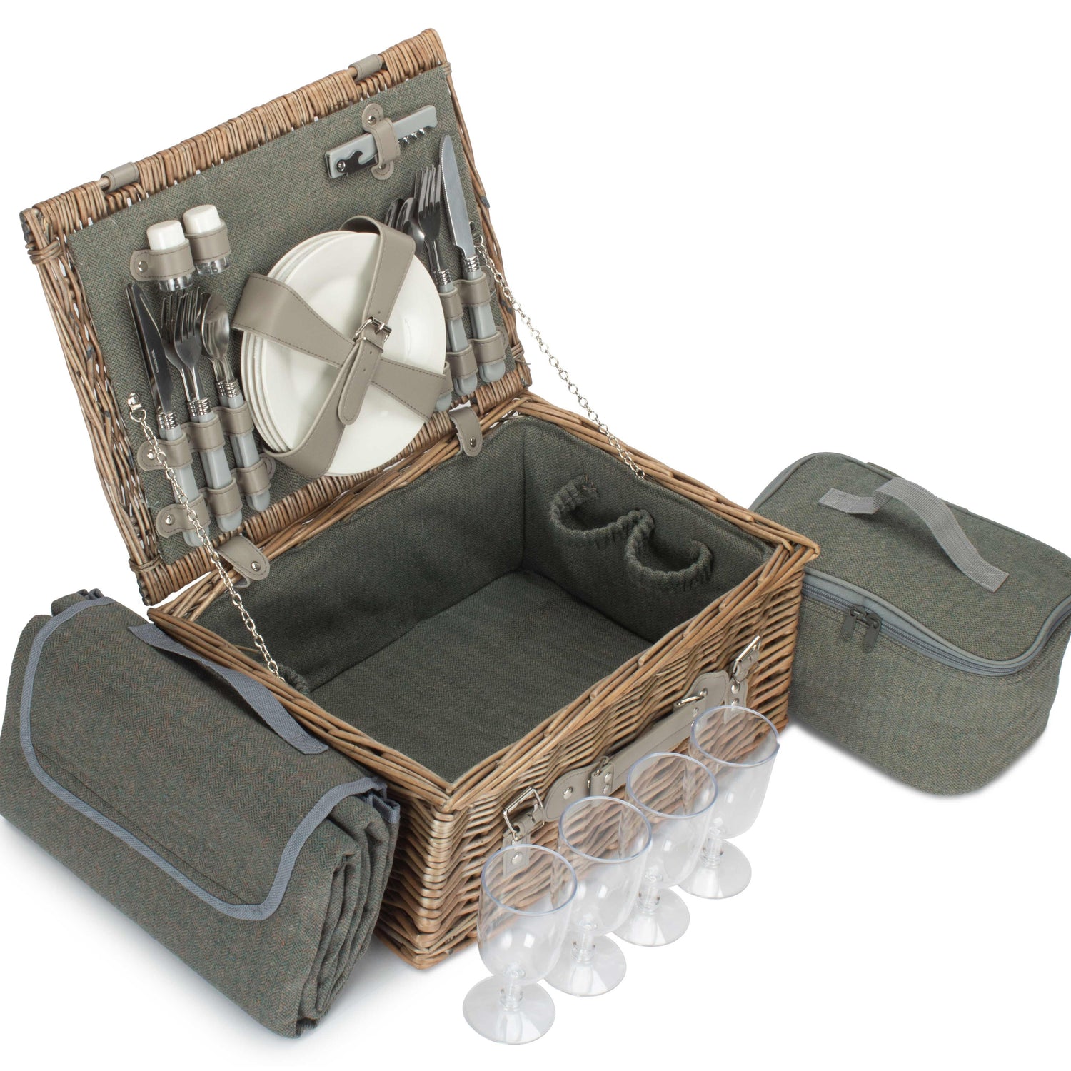 Picnic basket set with cutlery, plates, and wine glasses on a white background