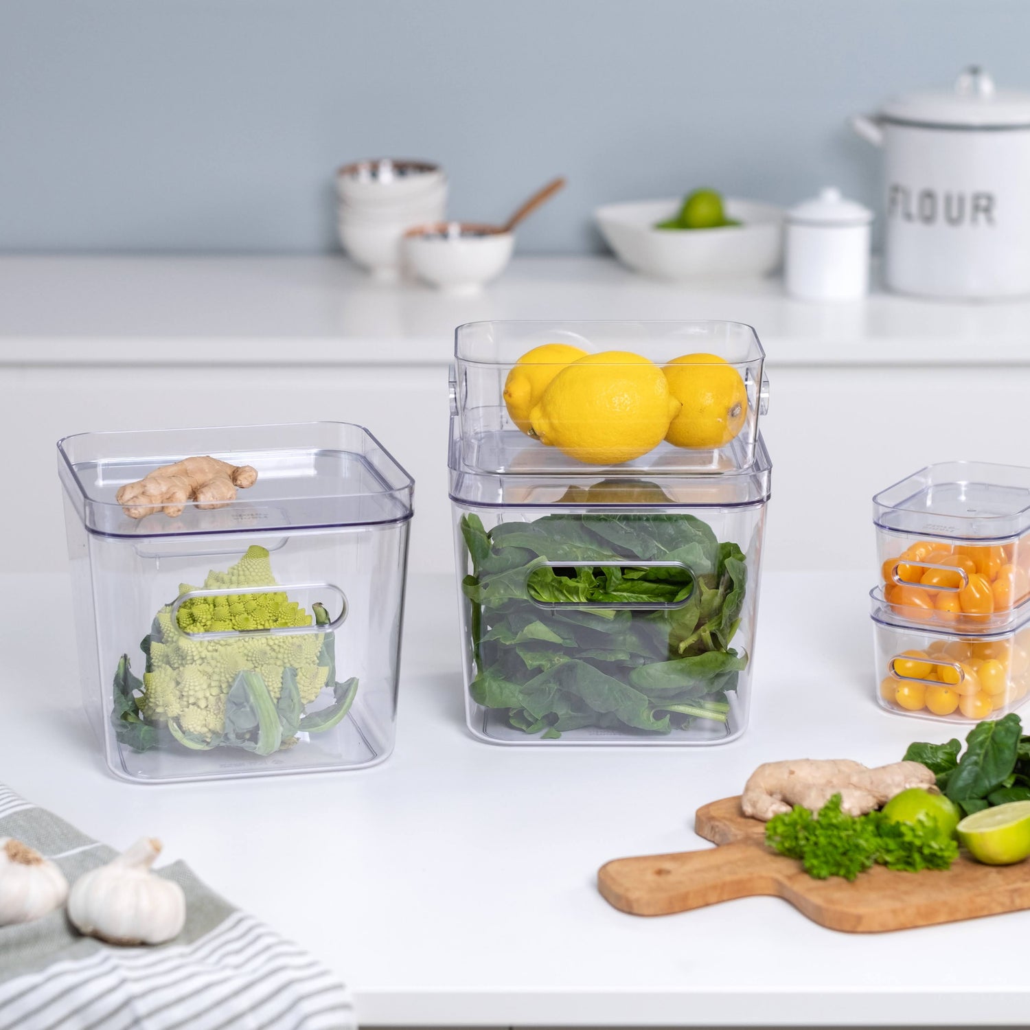 Clear plastic containers with food on a kitchen counter