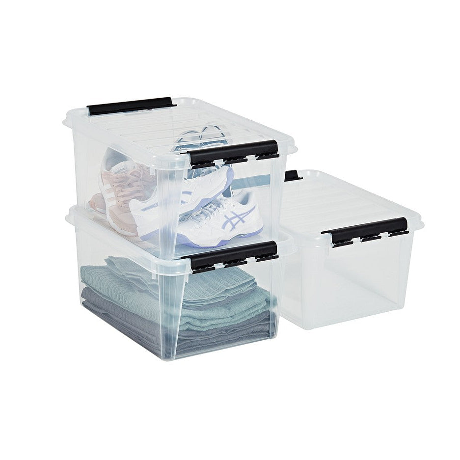 Clear storage boxes with black lids on a white background