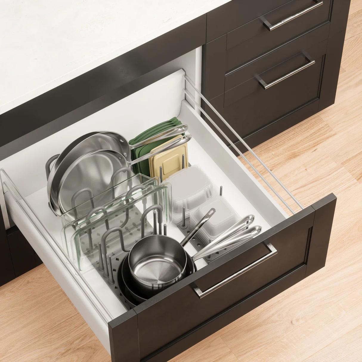 Open kitchen drawer with utensils and cookware and umbra peggy system