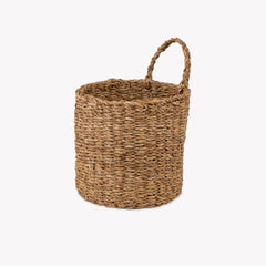 Woven basket with handles on a white background