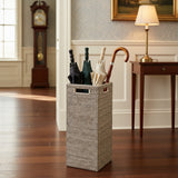 Wicker basket with umbrellas in a room with wooden floor and furniture