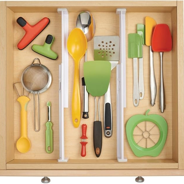 Wooden kitchen drawer with colorful utensils and tools