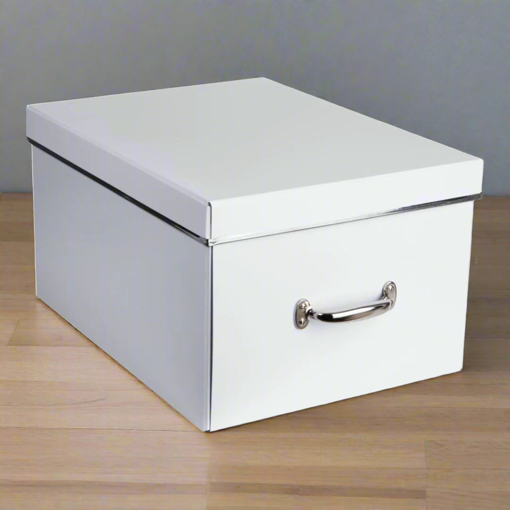 White storage box with a silver handle on a white background