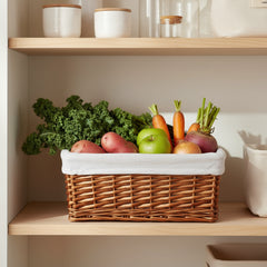Wicker basket with a white liner on a white background