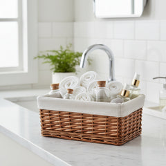 Wicker basket with a white liner on a white background