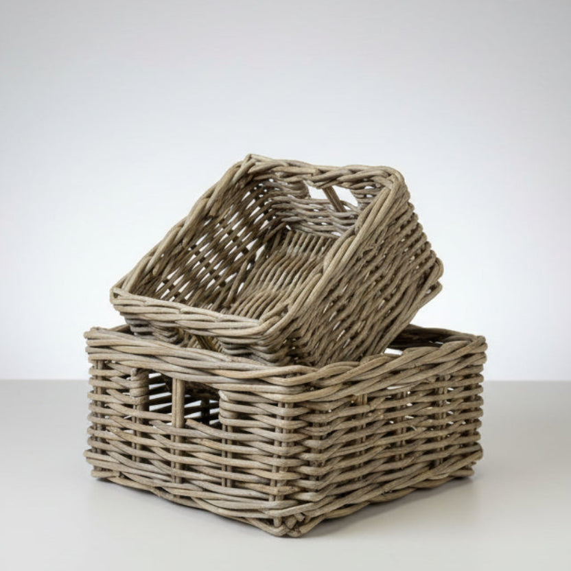 Two woven baskets on a white background