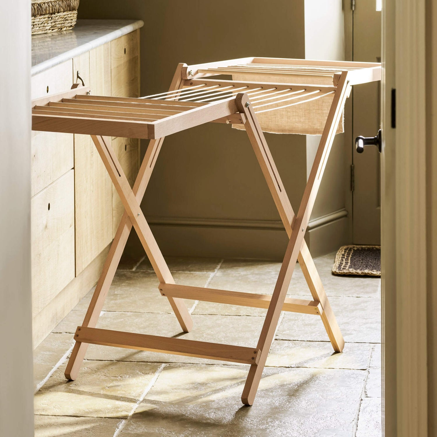 Wooden folding table in a room with a neutral color scheme