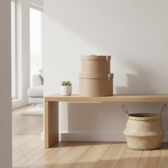 Two brown cardboard boxes with white ribbons on a white background