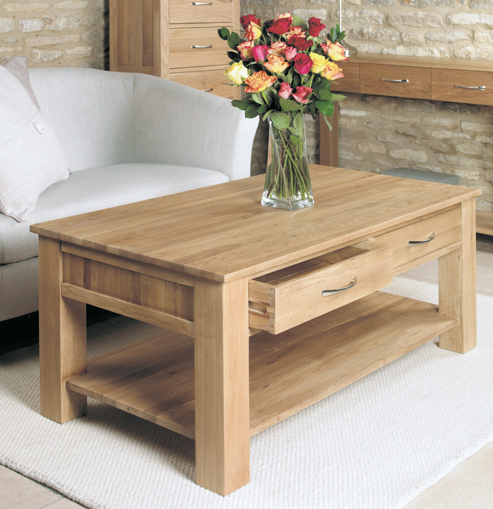 Wooden coffee table with a vase of flowers in a living room setting