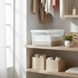 Clear plastic storage box on a white background