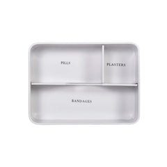 Gray divided tray with sections labeled 'Pills', 'Plasters', and 'Bandages' on a white background.