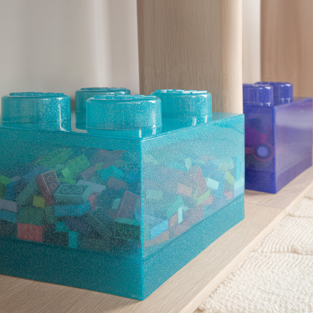 Blue toy blocks on a light wooden surface with a blurred background