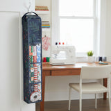 Tall, dark green bag with floral patterns on a white background