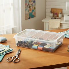 Clear plastic storage box with colorful markers inside on a white background