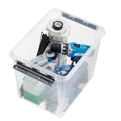 Clear storage box with various tools and equipment on a white background
