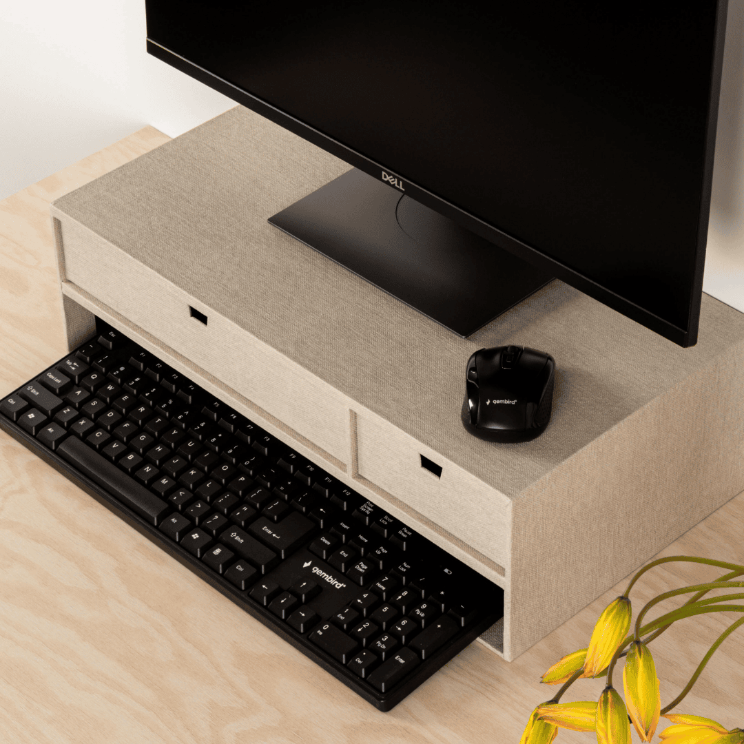 Computer setup with monitor, keyboard, and mouse on a wooden desk.