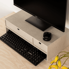 Computer setup with monitor, keyboard, and mouse on a wooden desk.
