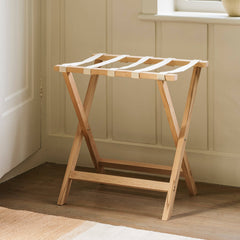 Wooden folding table in a room with a window and decorative items.