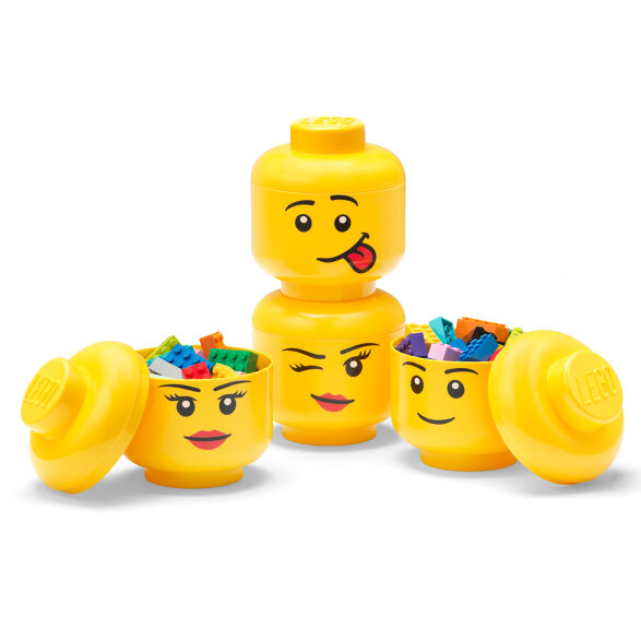 Set of yellow storage containers with face designs on a white background