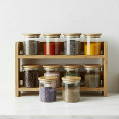 Clear glass jar with a wooden lid on a white background