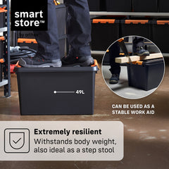 Black storage bin with text highlighting its resilience and multiple uses in a workshop setting.