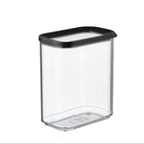 Clear storage container with black lid on a white background