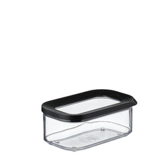 A clear plastic rectangular food storage container with a black lid, shown on a plain white background.