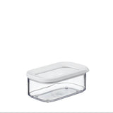A clear plastic food storage container with a white lid, shown on a plain white background.