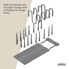 Gray pegboard system with pegs and dividers on a white background, featuring the Umbra brand.